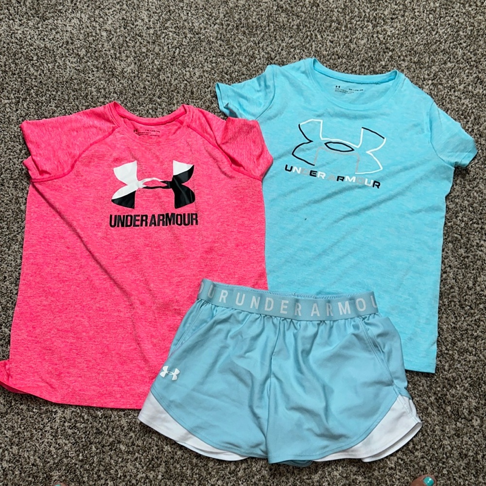 Girls Under Armour. Two dry fit shirts and shorts